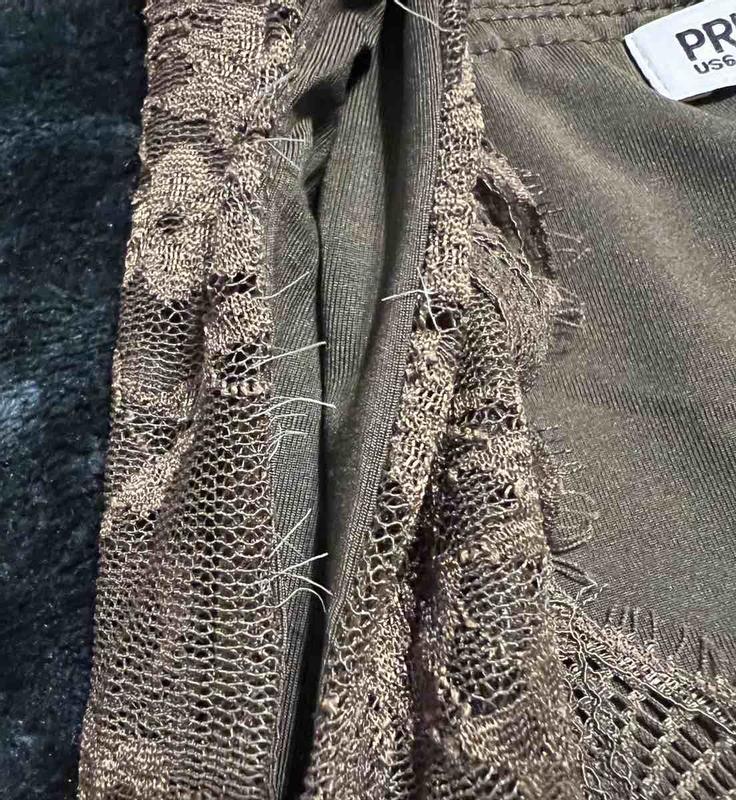 Customer photo for "Beautiful top but elastic frays quickly"