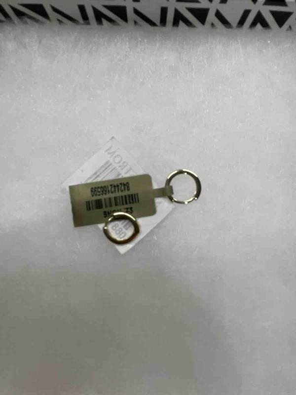 Customer photo for "earrings are great, shipping conditions are not."
