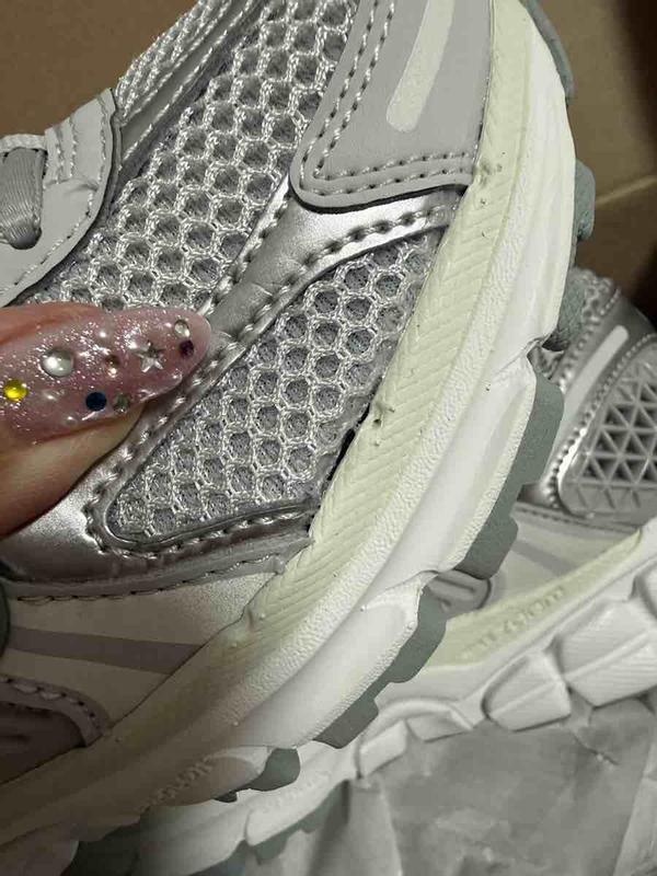 Customer photo for "RECEIVED SNEAKER WITH HOLE ON SIDE"