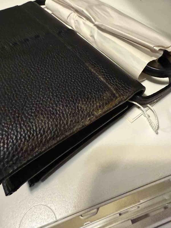 Customer photo for "Covered in mold wallet"