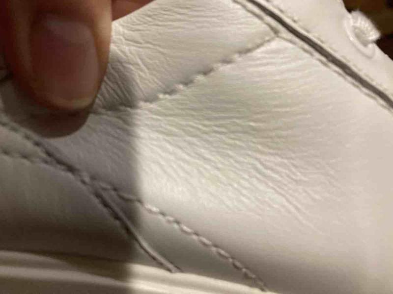 Customer photo for "bad stitching, wrinkly leather"