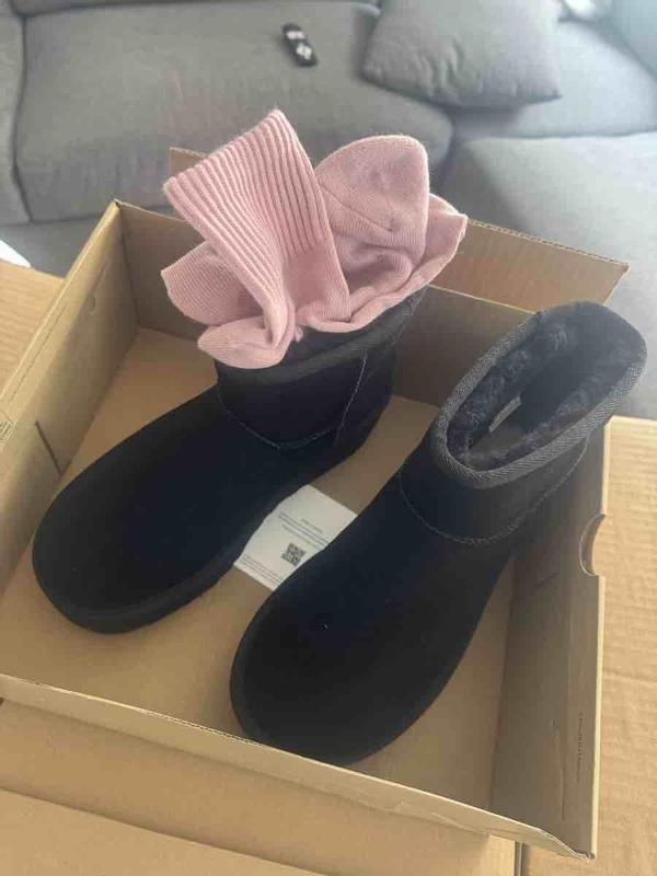Customer photo for "boots came with dirty socks inside"