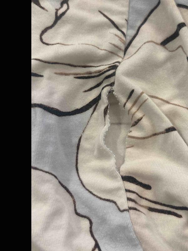 Customer photo for "pretty but sewn cheaply"