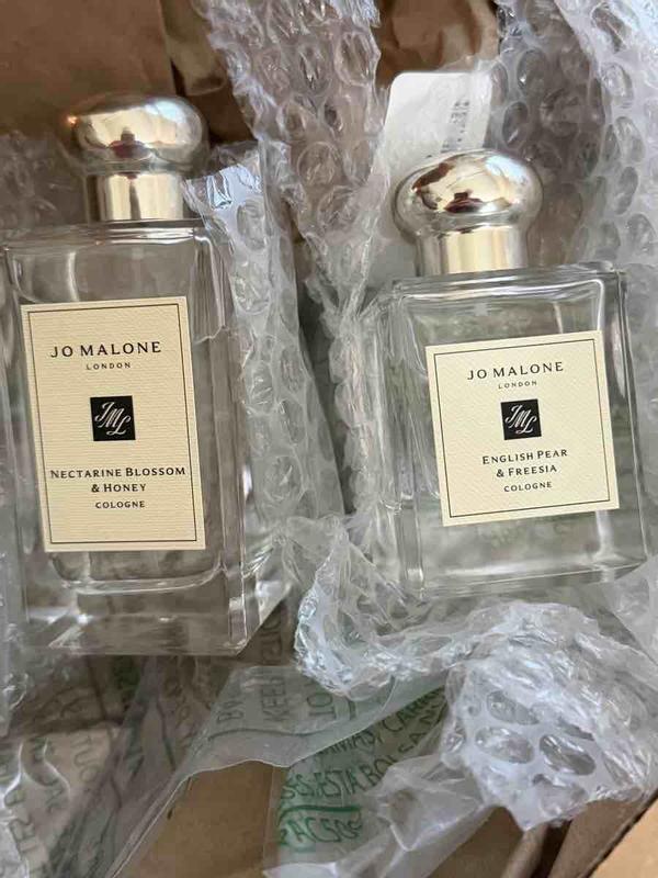 Customer photo for "Perfume smell amazing, but packaging awful"
