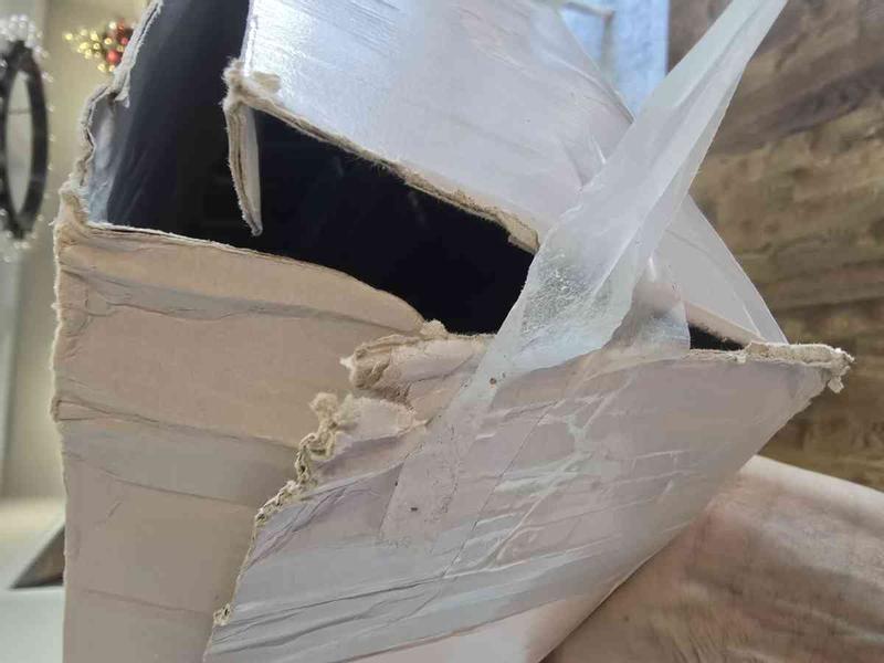 Customer photo for "Box damaged and looked used"