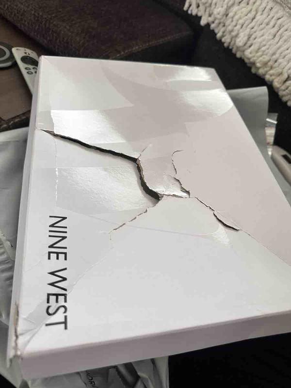 Customer photo for "the box is beat up and the shoes were used."