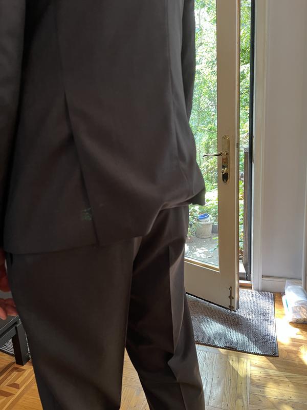 Back of the suit bunching up