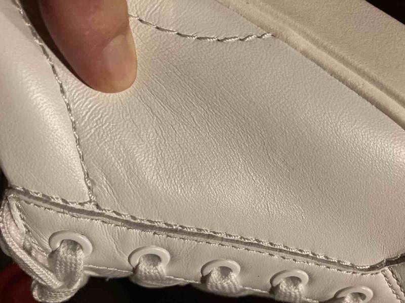 Customer photo for "bad stitching, wrinkly leather"