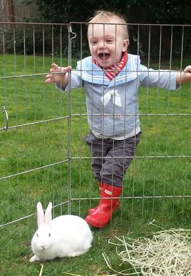 Customer photo for "He loves his puddle boots!"