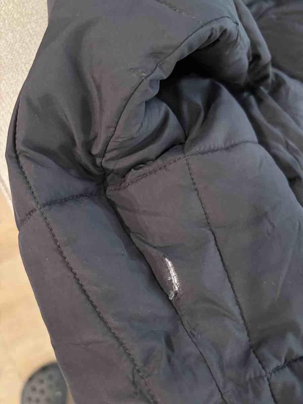 Customer photo for "Sent a Damaged, Dirty and Used Jacket"