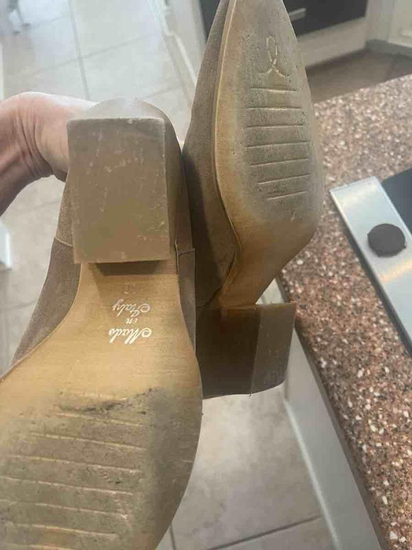 Customer photo for "Received used boots- sole/heel ripped up"