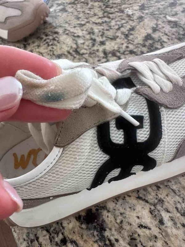 Customer photo for "Black bleeds onto the white on the shoe"