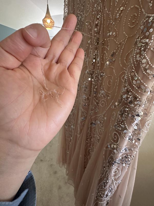 Customer photo for "Received a Used/Returned Defective Dress"