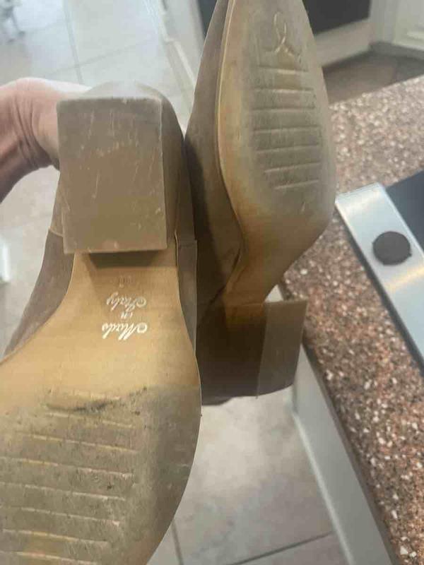 Customer photo for "Received used boots- sole/heel ripped up"