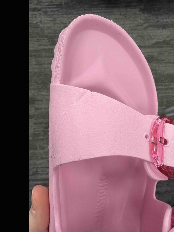 Customer photo for "plastic tags left permanent marks in shoes"