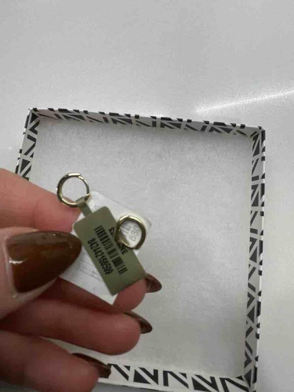 Customer photo for "earrings are great, shipping conditions are not."