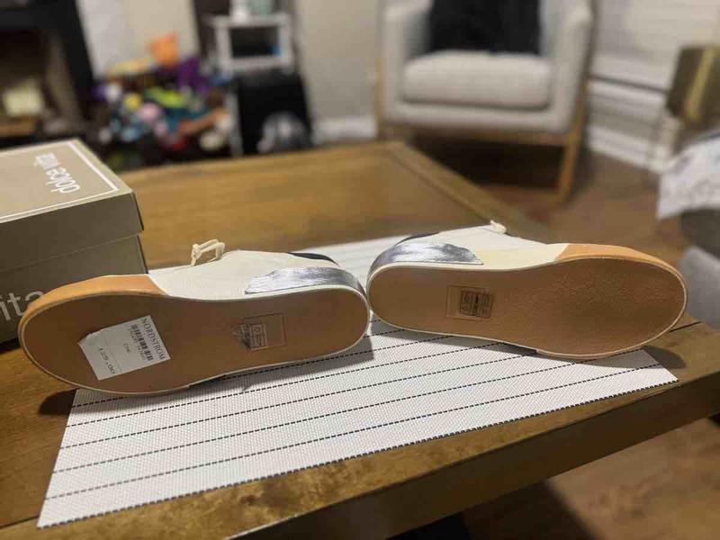 Customer photo for "mismatched sneakers"