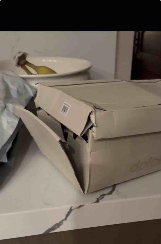 Customer photo for "shoes ok but beat up box"