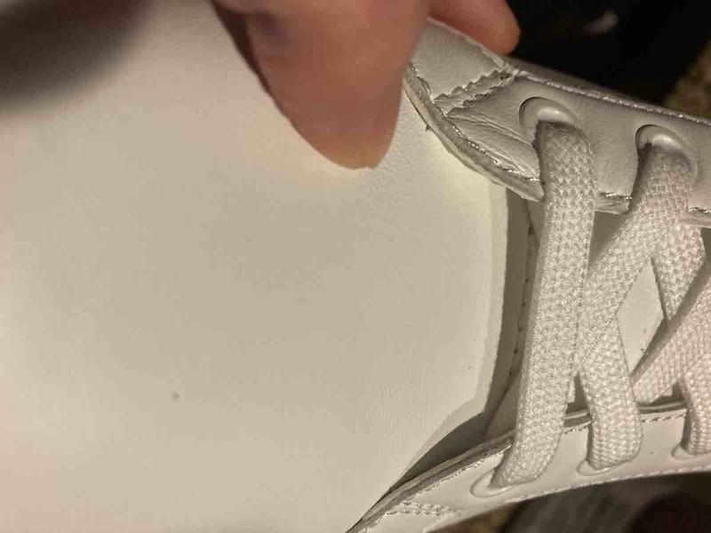 Customer photo for "bad stitching, wrinkly leather"