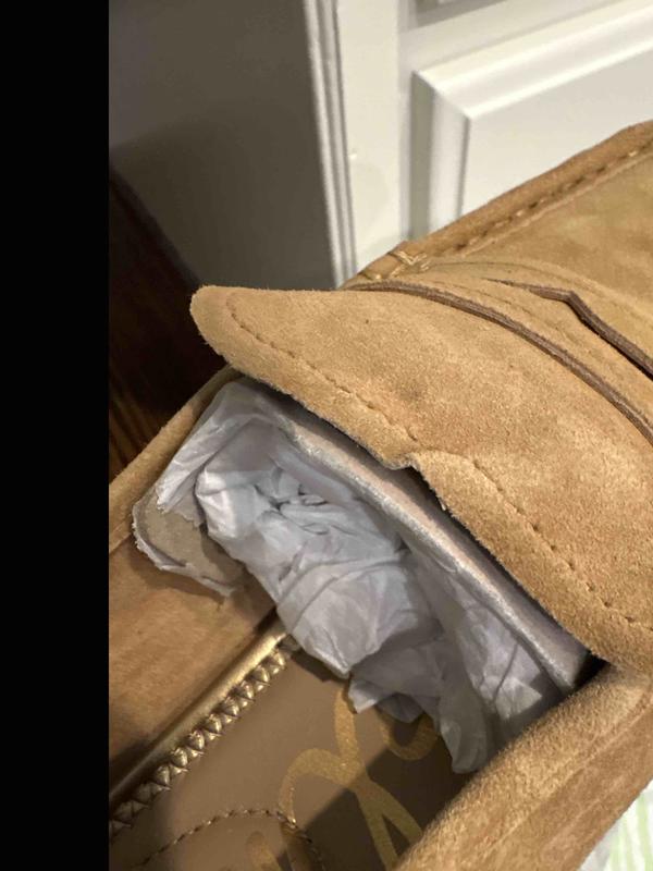 Customer photo for "tongue of shoe messed up"