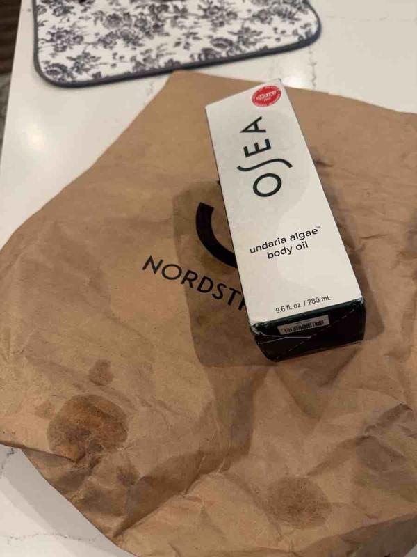Customer photo for "shipped oil in a paper bag and oil leaked"