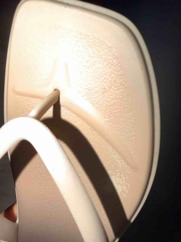 Customer photo for "Discolored flip flops"