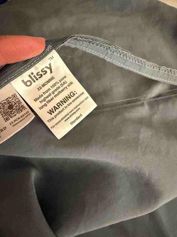 Customer photo for "less than 5 washings and the zipper tears away"