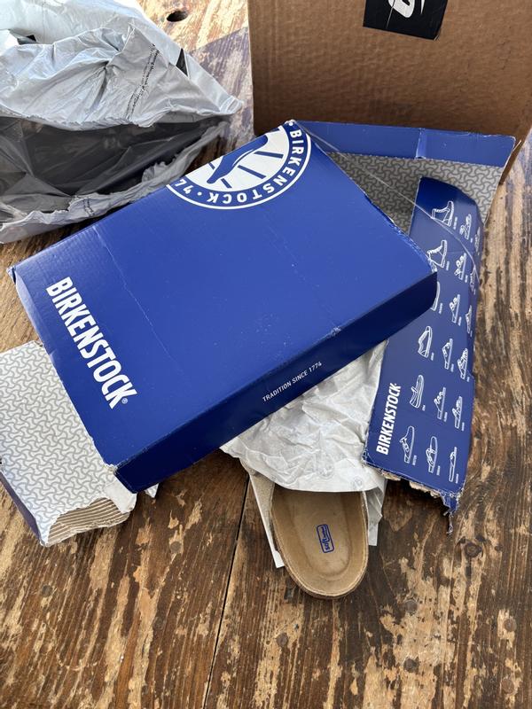 Customer photo for "Item delivered in torn up box"