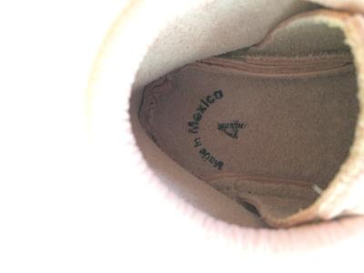 Customer photo for "Poor leather quality, not made in USA"