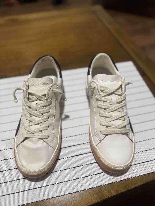 Customer photo for "mismatched sneakers"