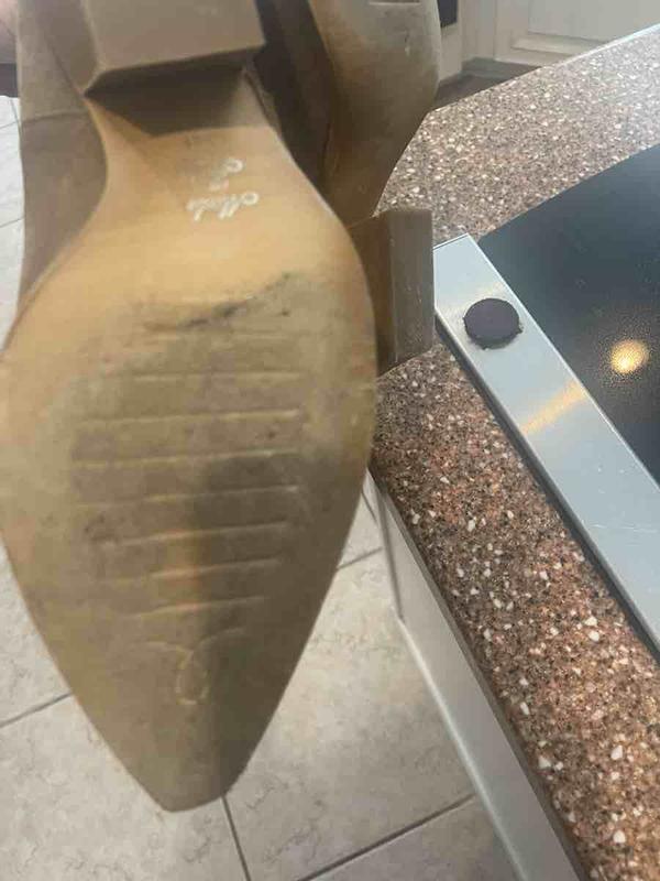 Customer photo for "Received used boots- sole/heel ripped up"
