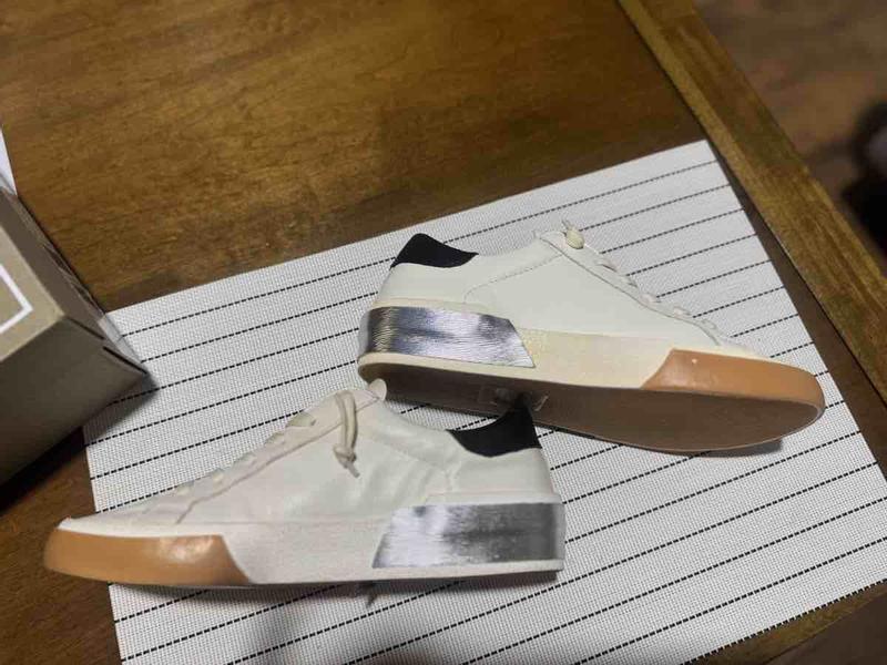 Customer photo for "mismatched sneakers"