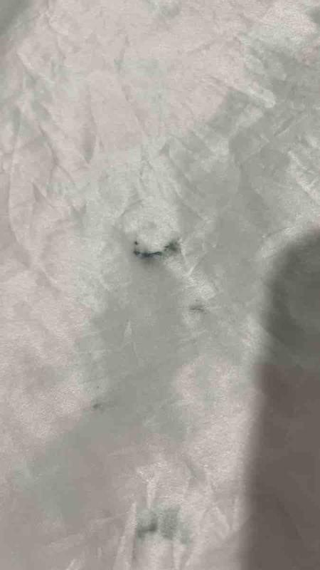 Customer photo for "The tag leaked blue ink!"