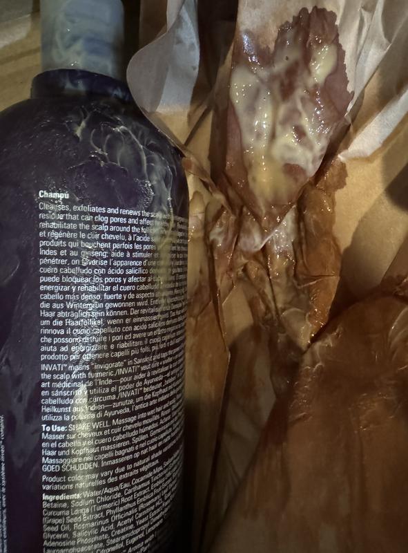Customer photo for "Spillage drained half of the shampoo."