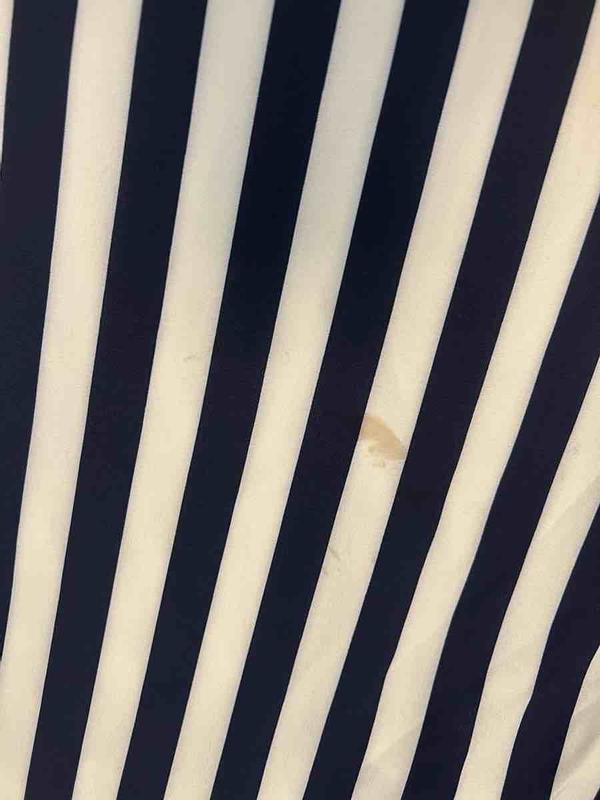 Customer photo for "Received disgusting, used, stained outfit"