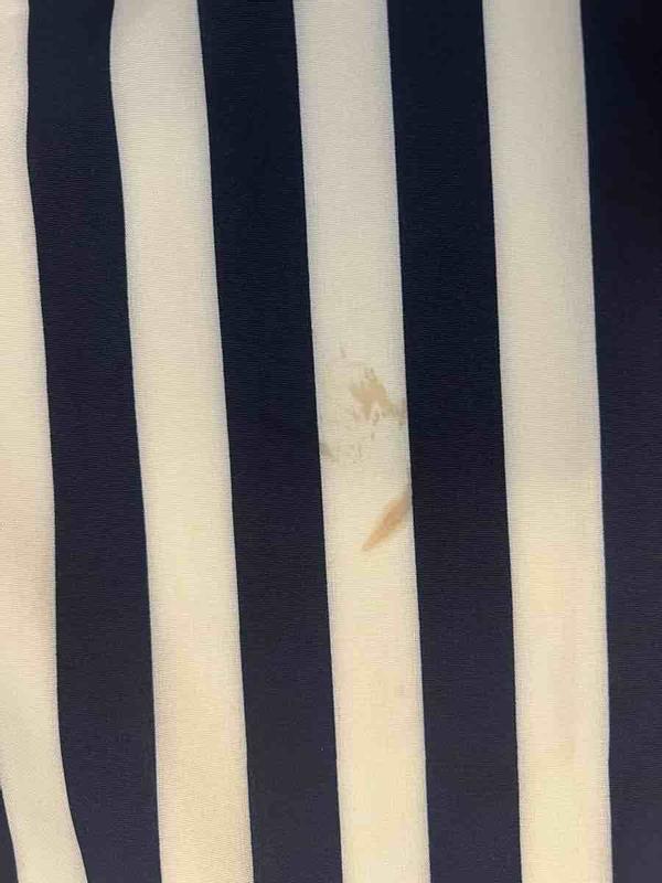 Customer photo for "Received disgusting, used, stained outfit"