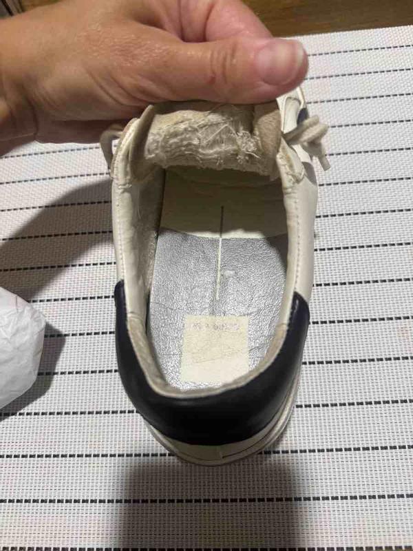 Customer photo for "mismatched sneakers"