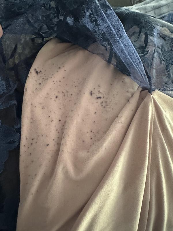 The lace rubs off on the dress below