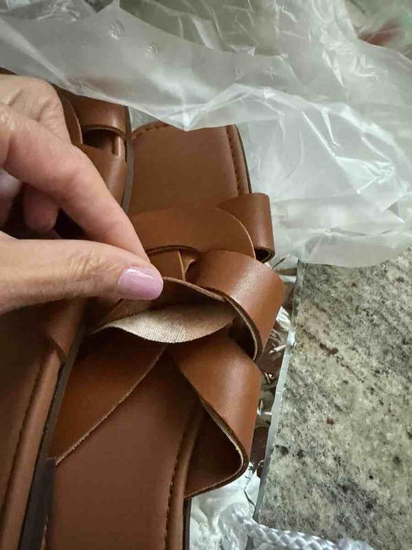 shoes are peeling and in plastic grocery bag