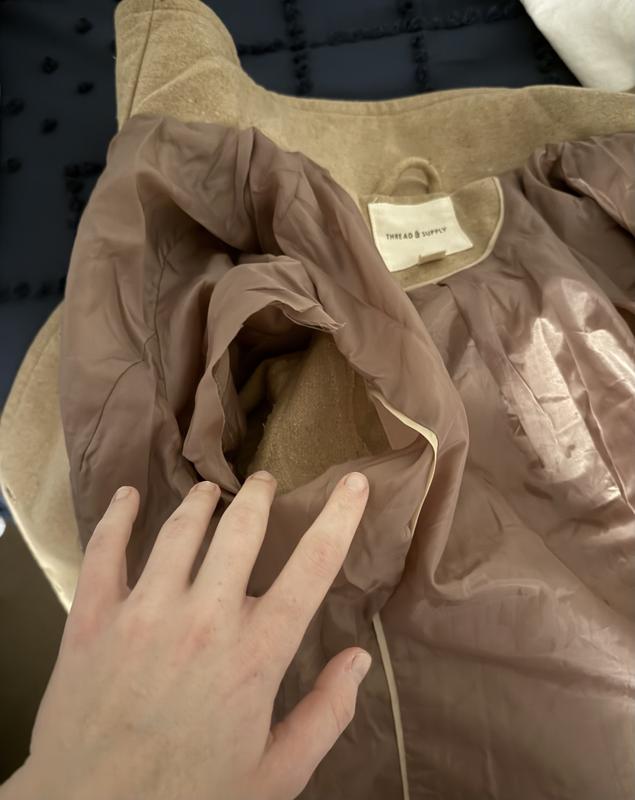 Received this cute coat torn apart inside