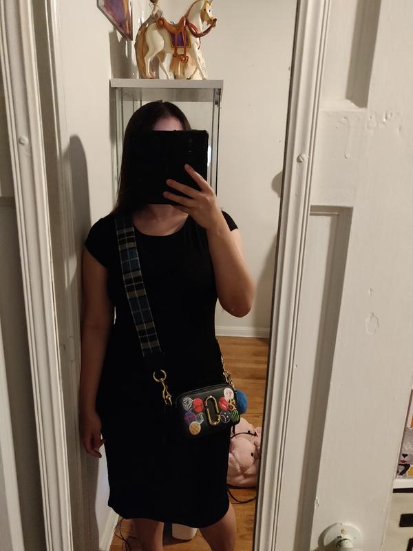 Customer photo for "Decent black dress. A little bit fitting to body."