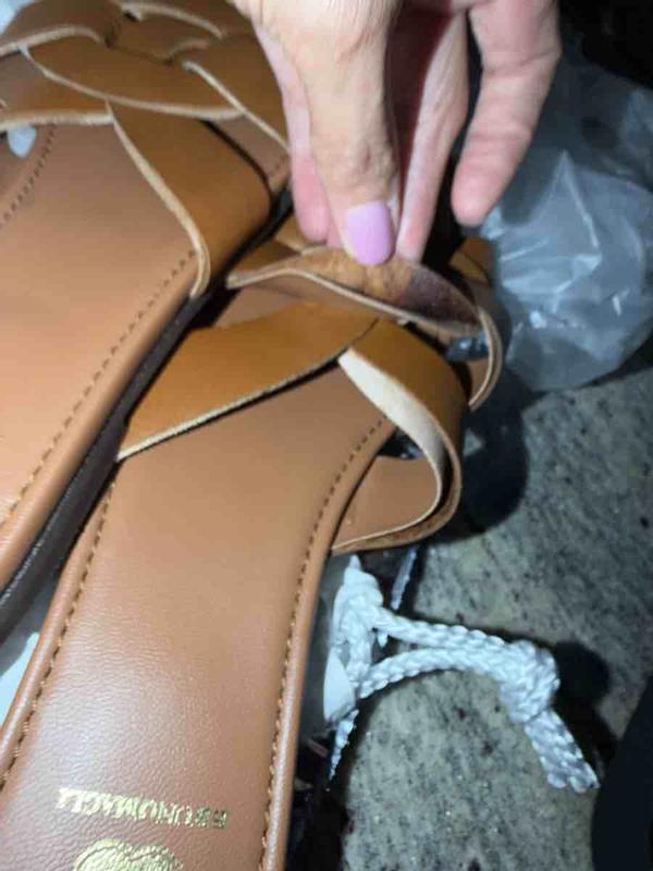 Customer photo for "shoes are peeling and in plastic grocery bag"