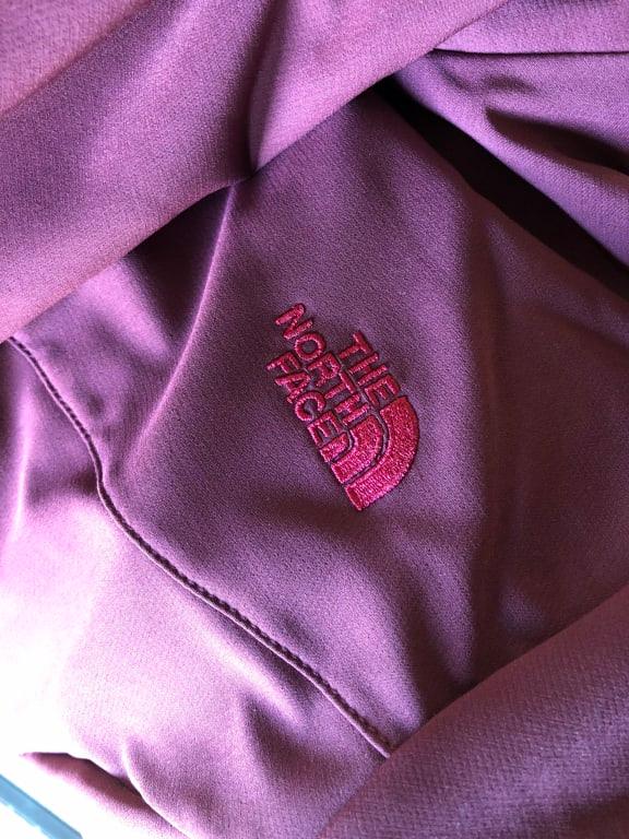 Pink logo on left front and right back