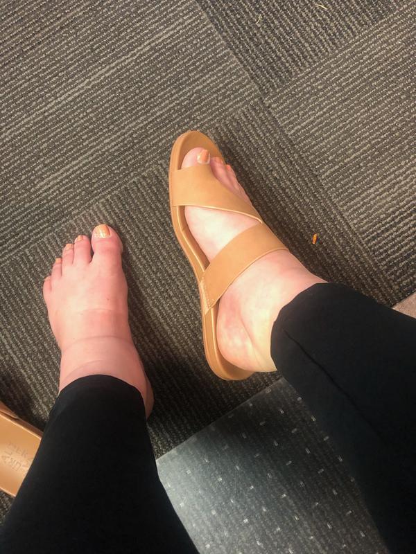 Top strap is tight. I have a wide foot with high arches.