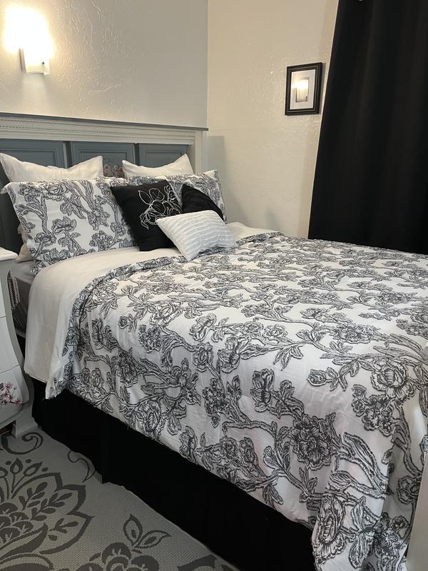 Grand Avenue Embrace timeless allure with our Floral Comforter Set. The  striking black and white palette effortlessly complements any style. Using  innovative Clip Jacquard technique, intricate floral patterns are woven  into the