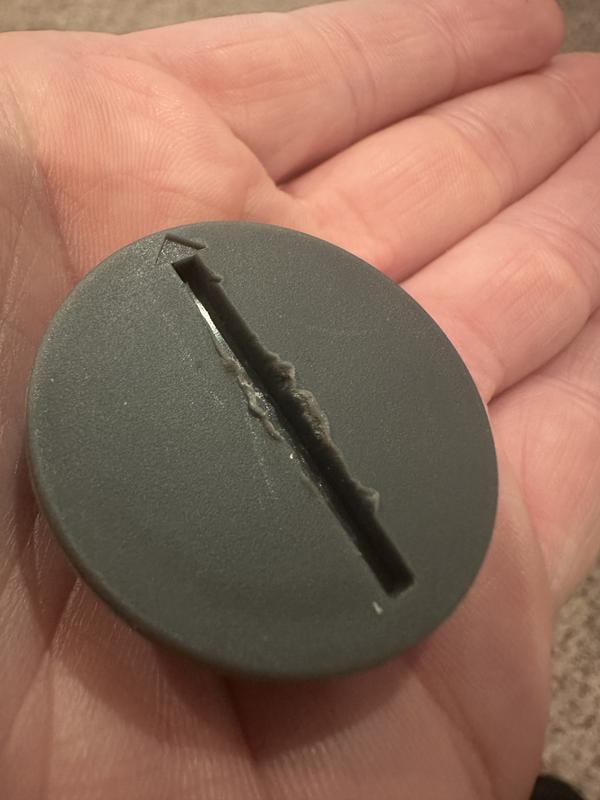 note damaged plastic along edge of slot.