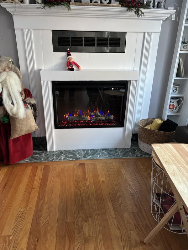 Installed in existing wood burning fireplace opening and boxed in