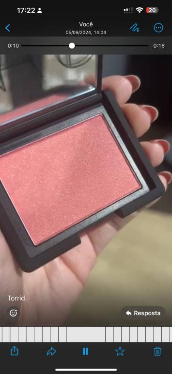 Pigmented coral blush with a golden shimmer.