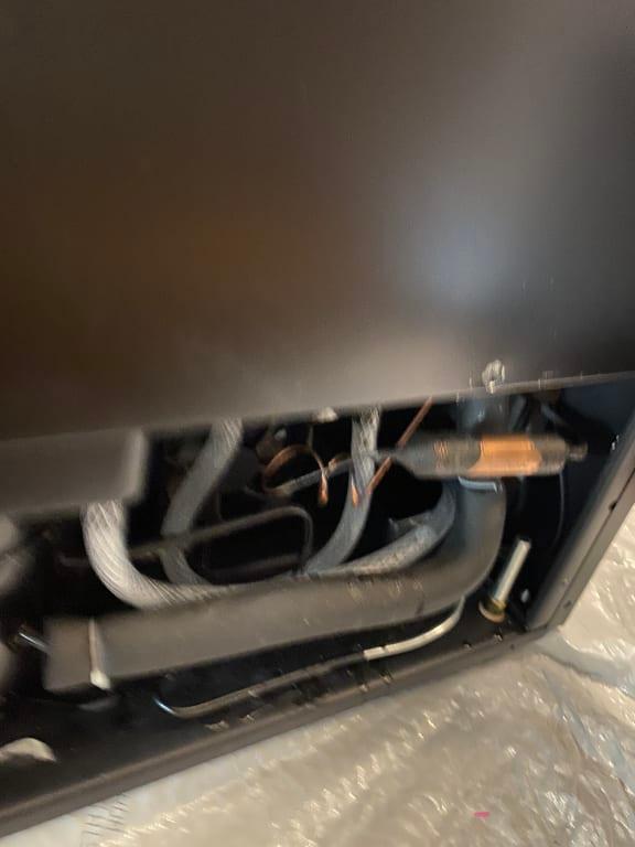 water hose that you need to drain container after defrost, always put a plastic bag under incase the container overflows