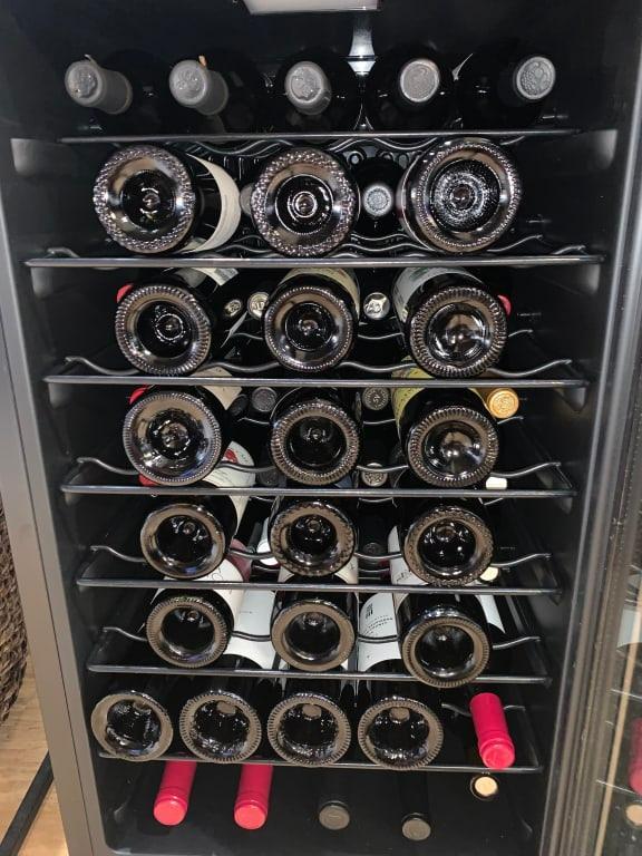 It is tight but 50 bottles do fit